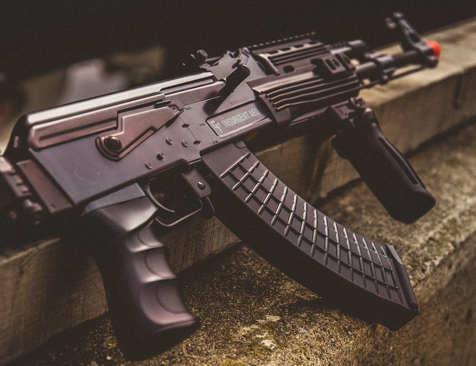 GameFace Insurgent AEG GFAR Indoor Lifestyle Sitting on Concrete